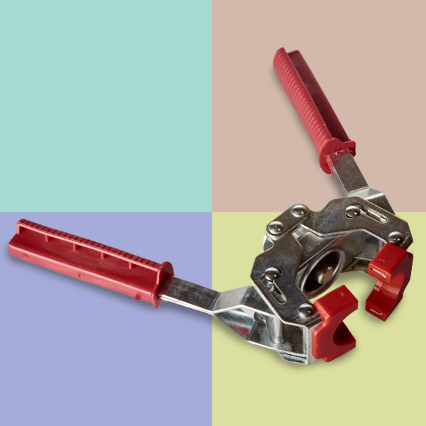 kapslylpåsättare mot flerfärgad bakgrund